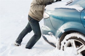 FeaturePics-Man-Pushing-Car-Stuck-Snow-112807-3197668